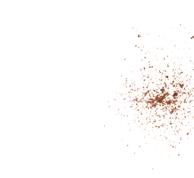 Scattered maple sugar crystals forming a loose cluster against a black background representing natural sweetness.