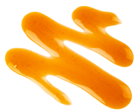 Drizzle of golden maple syrup with a smooth, glossy texture and small bubbles visible throughout