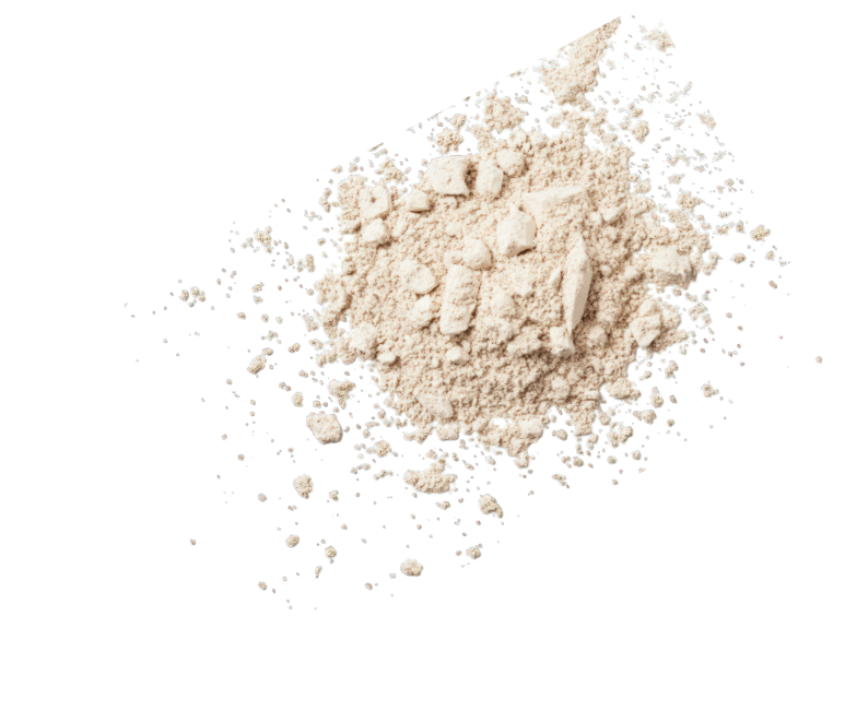 Light beige powder with small clumps scattered on a white background for natural pancake mix.