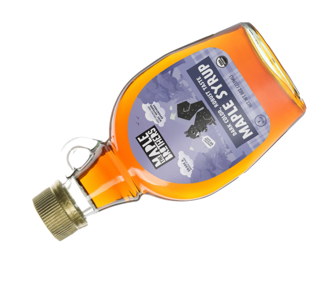 Bottle of dark color robust style maple syrup with a purple label from The Maple Brothers brand
